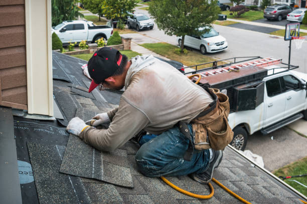 Professional Roof Replacement technician working in Gladstone, MI
